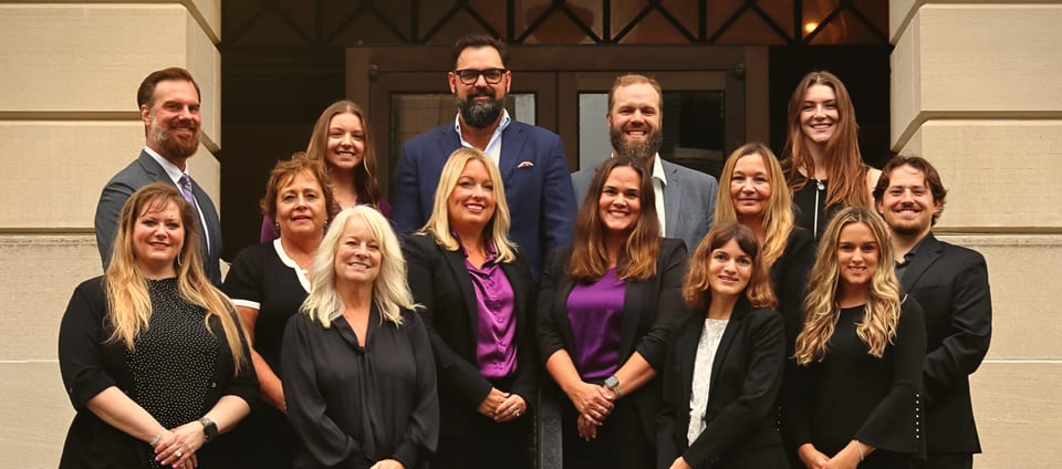 The Virtus Financial Group team, photographed together on the front steps of the St. Louis office.