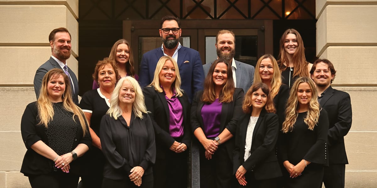 The Virtus Financial Group team, photographed together on the front steps of the St. Louis office.